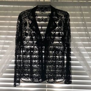 Beautiful sheer designed black dressy blouse.